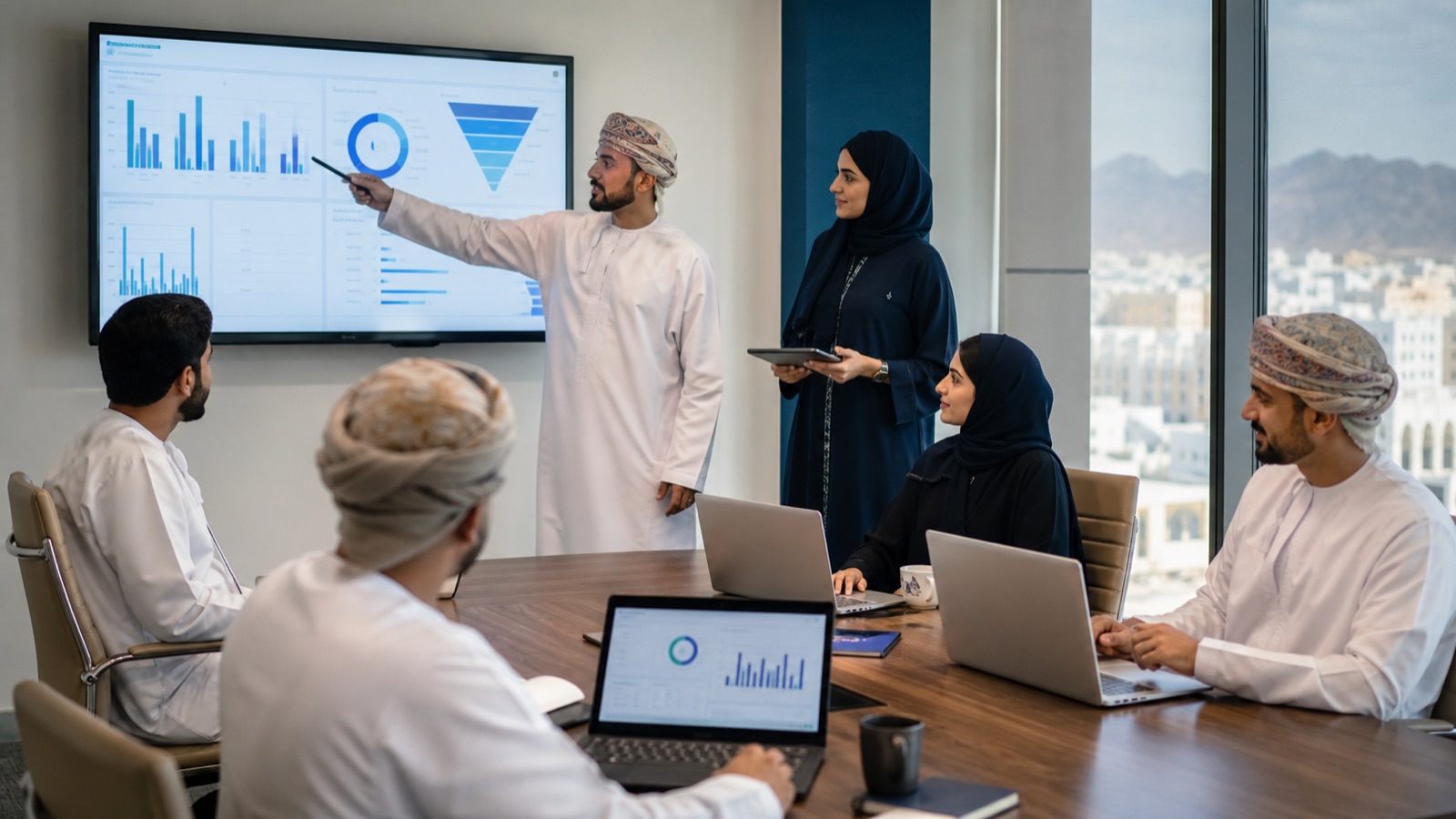 Sales and finance managers reviewing a quotation approval in Oman